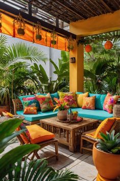 an outdoor living room with lots of plants and furniture on the patio, surrounded by potted palm trees