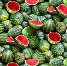 many watermelon slices are stacked up together