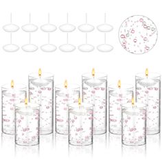 a set of six glass candles with pink flowers on them and bubbles in the middle