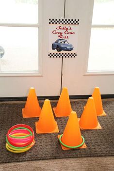 several orange cones are sitting on the floor