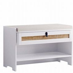 a white shelf with a wicker drawer underneath it