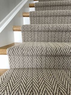 carpeted stairs leading up to the second floor