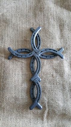 an iron cross is sitting on a burlock