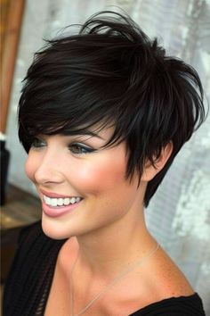 Layered Textured Pixie Short Layered Haircut. Short Piece Hairstyles, Hair Short In Back Long On Sides, Pixie Haircut From The Back, Long Pixie Haircut With Undercut, Long Sides Short Back Hairstyles, Short Layered Stacked Bob Haircut, Short Hair Stacked In Back, Back Of A Pixie Haircut, Layered Long Pixie Haircut