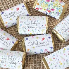 baby is blooming candy bar wrappers with gold foil on the top and flowers all over them