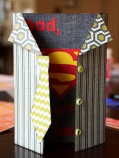 an origami box with superman's tie on it