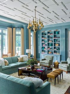 a living room with blue walls and furniture