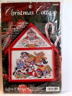 a cross stitch christmas cottage ornament