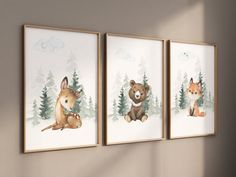 three framed pictures with animals hanging on the wall