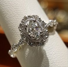 a diamond ring on top of a white napkin