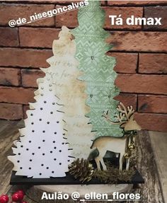 a wooden christmas tree sitting on top of a table