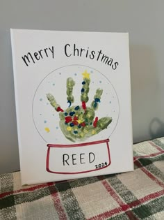 a handprinted christmas card with the words merry christmas red and green on it