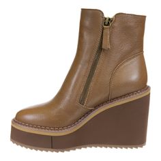 a women's brown wedged boot with zippers