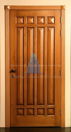 a wooden door with glass paneling on the front and side panels, in an empty room