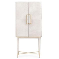 a white cabinet with two doors and gold handles on the front, against a white background