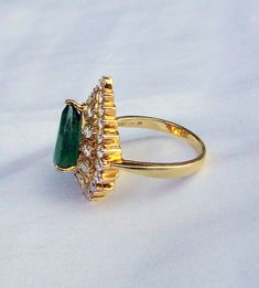 18K Hallmarked Gold Natural pear Emerald & VVS FG quality IGI certified Diamond Ring. Size of top-2.3/2 cm, Gross weight-7.400 grams,39 pieces Diamond weight-1.28 carat,Emerald weight-5 carat approx. Formal Pear-shaped Emerald Ring With Halo Setting, Pear-shaped Emerald Ring For Anniversary, Pear-shaped Emerald Anniversary Ring, Green Teardrop Diamond Ring For Formal Occasions, Classic Teardrop Emerald Ring For Formal Occasions, Pear-shaped Emerald Ring With Prong Setting For Anniversary, Gia Certified Pear-shaped Ring For Formal Occasions, Gia Certified Pear Shaped Ring For Formal Occasions, Pear-shaped Gia Certified Ring For Formal Occasions