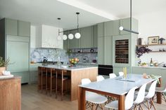 the kitchen is clean and ready to be used for dinner or lunch time, as well as dining room furniture