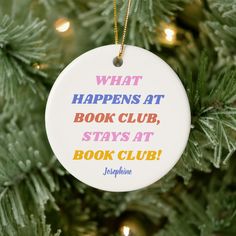 a book club ornament hanging on a christmas tree with the quote what happens at book club stays at book club