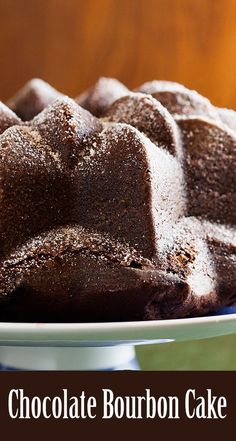 chocolate bourbon cake on a plate with the words chocolate bourbon cake in front of it