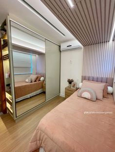 a bedroom with a bed, mirror and closet in it's center area is shown