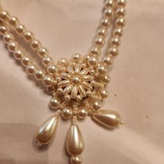 Beautiful fir a bride! Very old faux pearl necklace. Has extender chain and is double Strand. Looks New. No flaking ir discoloration. The center is reversable! How unique Victorian Pearl Drop Necklace For Formal Occasions, Antique Pearl Chain Jewelry For Formal Occasions, Formal Antique Pearl Drop Necklace, Pearl White Wedding Jewelry With Pearl Buttons, Vintage Pearl Charm Jewelry For Anniversary, Vintage Jewelry With Pearl Charm For Anniversary, Vintage Pearl-embellished Jewelry For Formal Occasions, Vintage Pearl-embellished Jewelry For Formal Events, Victorian Pearl Necklaces For Formal Occasions