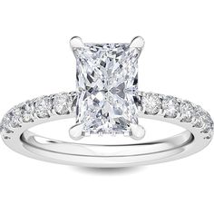 a princess cut diamond engagement ring with pave set shoulders