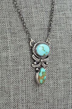 This stunning Sonoran Gold turquoise and sterling silver necklace was made by Navajo silversmith Loretta Delgarito. The back is signed LD and stamped sterling.Necklace: 16" with additional 2" extender chainPendant Length: 1 3/8"Pendant Width: 3/4"Free shipping on all orders! We ship with USPS and always include tracking. All orders ship within a day of payment.Returns are accepted up to 30 days after you receive your order. Just send us a message. Our shop offers cash back or store credit. The item must be returned in new condition. Luxury Southwestern Sterling Silver Necklaces, Luxury Traditional Silver Turquoise Necklace, Blue And Silver Necklace Southwestern, Silversmithing Jewelry, Silver Smithing, Sterling Necklace, Silver Turquoise Jewelry, Metalsmithing Jewelry, Turquoise Jewelry Native American