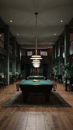 a pool table in the middle of a large room with chairs and tables around it