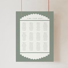 a seating chart hanging on a wall