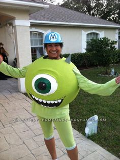 a person in a costume that looks like an alien with big eyes and large teeth