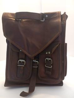 This is nice full grain leather backpack that it is already broken. The rugged look gives this  bacpack a lots of character but the soft leather makes it confortable on your back. Can be wore as a back pack or messenger bag. It is already treated with waterproof mink oil Rugged Leather Satchel Backpack, Brown Soft Leather Satchel Backpack, Adventure Leather Satchel Backpack, Leather Satchel Backpack For Adventure, Adventure Shoulder Bag With Leather Backing, Brown Rugged Standard Backpack, Rugged Brown Standard Backpack, Adventure Leather Satchel Backpack With Leather Backing, Brown Waxed Finish Backpack Shoulder Bag