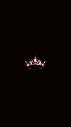 a crown is lit up in the dark