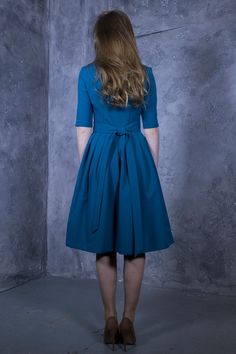 Blue green shade dress with pleated skirts. Dress with mid sleeves and zipper on the side, tying belt at the back. ➤ Features > dress length: 103 cm / 40,5'' - 107 cm / 42,1'' > mid sleeves > rounded neckline > pleats at skirt part > tying waistband at the back ➤ Sizing My Size Guide in FAQ section below will help you define the perfect size match. The item can also be made according to your measurements - just message them to me. ➤ Delivery Your item is made-to-order and will be Formal Dress Office, Office Dress Women, 1950's Dress, Dress Office, Dress Stylish, Abstract Dress, Office Dress, Oversized Dress, Office Dresses