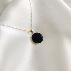 This stunning pendant is set in 14k Solid Yellow Gold with Natural Black Onyx with utmost precision. It is a unique gemstone pendant for nearly every occasion and is completely hassle-free jewelry. ITEM DETAILS: * GEM: Black Onyx * GEM Size: 15x15mm * GEM Shape: Round (Flat Cut) * Gem Weight: 6.05 carats * Gold Purity: 14KT  * Gold Weight: 0.90 gram * Total Weight of the Pendant: 2.11 gram The Gold purity is guaranteed and it comes with an authentic 14KT gold hallmark. Since my items are handmad Onyx Gemstone Aesthetic, Elegant Onyx Jewelry With Tarnish Resistance, Elegant Onyx Jewelry Tarnish Resistant, Timeless Black Pendant Necklace, Elegant Black Necklace With Black Enamel, Timeless Black Enamel Necklace, Fine Jewelry Black Necklace With Black Enamel, Elegant Onyx Necklace With Black Enamel, Timeless Onyx Gemstone Jewelry