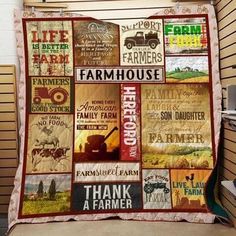 a blanket that has many farm related items on it, and is hanging up against a wall