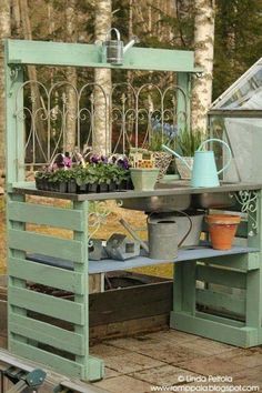 an outdoor potting bench made out of pallets