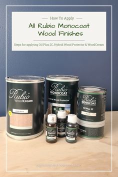 some paint cans are sitting on a table with the words how to apply all rubi monocoat wood finishes