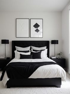 a bedroom with black and white bedding, two pictures on the wall above it