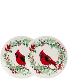 two plates with red birds and green leaves on them