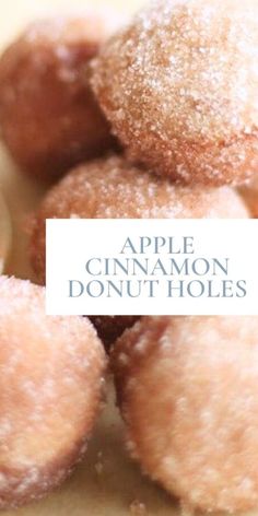 a pile of cinnamon donut holes sitting on top of a white tablecloth with the words apple cinnamon donut holes