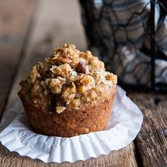 a muffin sitting on top of a white paper plate