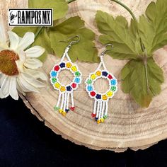 Beautiful Handmade Mexican Earrings , Mexican Shakira Earrings , Bohemian Boho earrings. 100% Handmade Handcraft by great Artisans in Mexico , These lovely Ear Wire earrings are extremely light and can be worn on all everyday occasions specially if you like colorful and fresh accessories. Aprox Size : 3 1/4 inches length & 1 3/8 inch wide Every piece is unique and color might change a little , depending on the screen device its been viewed on Aretes Mexicanos de Shakira , hecho a mano , Arte for Multicolor Beaded Flower Earrings For Festivals, Multicolor Round Chandelier Earrings For Pierced Ears, Multicolor Drop Earrings With Dangling Beads, Colorful Bohemian Round Beaded Earrings, Multicolor Flower Drop Earrings With Dangling Beads, Multicolor Drop Flower Earrings, Bohemian Rainbow Earrings With Ear Wire, Bohemian Beaded Round Flower Earrings, White Bohemian Hoop Earrings With Colorful Beads