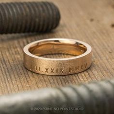 a close up of a wedding ring on the ground