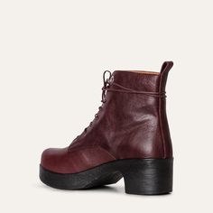 The Jonna lace-up boot in soft Plum leather makes a chic statement. The boot features a low, chunky clog-style heel in contrasting black and a pull-tab for easy wear. The removable anatomical sole provides optimal support, while our unique flexible sole means the Jonna boot can be worn comfortably all day long. Handmade in Portugal Unique Calou sole, soft and lightweight removable anatomic footbed Heel height 5,5 cm / 2,16 in Shaft height 14 cm / 5,52 in Fall Lace-up Boots With Vibram Sole For Workwear, Fall Heeled Boots With Vibram Sole, Medium Width Lace-up Ankle Boots With Stacked Heel, Lace-up Ankle Boots With Stacked Heel, High-top Leather Boots With Stacked Heel, Leather High-top Boots With Stacked Heel, Leather Combat Boots With Stacked Heel For Fall, Leather Combat Boots With Stacked Heel And Round Toe, Leather Combat Boots With Stacked Heel