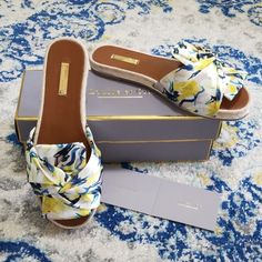 Louise Et Cie Camille Satin Twist Bow Slide Sandal Egrit Print Citrine Size 9 M New In Box! Retail $99 Now 50% Off Size 9, Runs Slightly Long Gorgeous Satin Scarf Printed Slides Twisted Bow Design In Beige, Yellow, White, And Teal Blue Crane Print Espadrille Flat Slip-On Style Leather Footbed With Gold Logo Rubber Outsole Silver Detail Along Seam Size 9: 10 3/8" Long, 3 5/8" Wide Designer Slip-on Sandals With Sculpted Heel, Spring Bow Slip-on Mules, Summer Slip-on Sandals With Logo Print, Slip-on Synthetic Sandals With Bow Detail, Bow Slides, Gold Buckle Closure Slip-on Sandals, Gold Logo, Bow Design, Flat Espadrilles