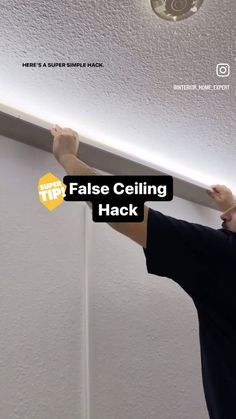 a man is fixing the ceiling in his house