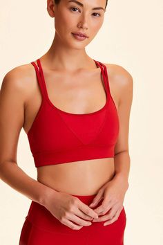 Luxury athleisure for powerful women everywhere. A woman run, women led brand, Alala offers a sophisticated yet bold take on activewear. Alala borrows its name from the Greek Goddess whose title signifies a battle cry, a call to arms. High impact sports bra in solid Ruby Criss-crossed cami back straps Front V insert Elastic band Pockets for optional cups Flatlock seaming Sports Bra Collection, Bra Collection, Red Sports Bra, Lounge Bra, Bra Size Charts, Light As A Feather, Tennis Fashion, High Impact Sports Bra, Seamless Bra