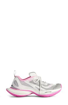 Balenciaga's exaggerated proportions define a track-style sneaker designed with a springy, bulbous heel and a raised, rubberized logo at the back. 2" (50mm) heel Lace-up style Textile upper and lining/synthetic sole Imported Designer Shoes Pink Chunky Sneakers With Boost Midsole For Streetwear, Pink Low-top Chunky Sneakers For Light Sports, Sporty Pink Chunky Sneakers With Boost Midsole, Athleisure Chunky Sneakers With Air Cushioning For Streetwear, Low-top Chunky Sneakers With Air Cushioning, Athleisure Low-top Chunky Sneakers With Air Cushioning, Pink Chunky Sneakers For Streetwear In Athleisure Style, Pink Chunky Sneakers For Streetwear Athleisure, Pink Chunky Sneakers With Translucent Outsole For Sports