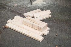 several pieces of wood laying on the ground