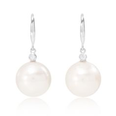 A show-stopping pair of large cultured freshwater pearl drop earrings on silver hooks with a delicate cubic zirconia sparkle above to twinkle with every twist and turn.    Timeless pearls to make the maximum impact!  13-14mm off round cultured freshwater pearl drop earrings on sterling silver hooks with cubic zirconia above - approx 1. 25" in length Pearls are quite soft and need special care after you wear them. Always store them in a separate jewellery pouch away from other jewellery and it is best to keep them in something soft.  From time to time, after you wear your pearls you should wipe them with a soft damp cloth to prevent dirt, chemicals and perspiration from diminishing the lustre of the pearls.  Always remember to take off your pearls when applying cosmetics, hairspray and perf Silver Diamond Dangle Earrings With Pearl Drop, White Pear-shaped Diamond Earrings With Pearl Drop, Pear-shaped White Diamond Earrings With Pearl Drop, Elegant Teardrop Pearl Earrings With French Hook, Elegant Silver Pearl Earrings With French Hook, Pear-shaped Pearl Drop Earrings In Diamond White, Elegant Pearl Earrings With French Hook, Diamond White Pear Pearl Drop Earrings, Elegant Pearl Drop Earrings With Hook